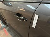 a car door handle with a sticker on it