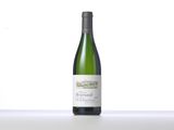 a bottle of white wine sitting on top of a table