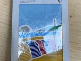 a box with a picture of a beach chair and umbrella on it