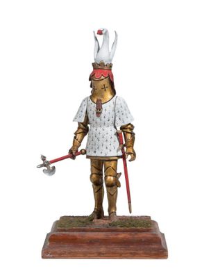 statue of a man dressed in armor with a sword and a helmet