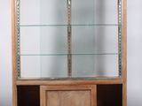 an image of a wooden display case with glass shelves