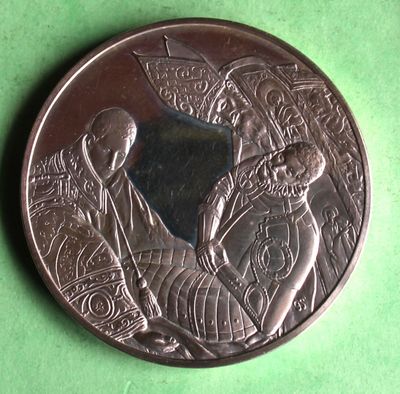 une pièce de monnaie en argent portant l'image d'un homme et d'une femme