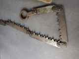 a pair of saws that are laying on a table