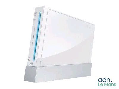 a white video game console sitting on top of a white table