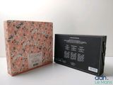 an open box with a pink and black design on it
