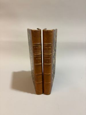 two books that are sitting side by side on a table