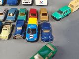 a lot of toy cars that are sitting on a table