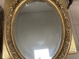a mirror that is sitting on the floor next to a mirror
