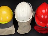 three hard hats that are sitting next to each other