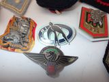 a lot of badges that are on a table