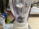 a blender sitting on top of a counter in a kitchen