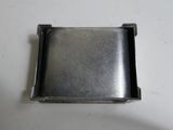 a close up of a metal object on a white surface