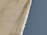 a close up of a pair of scissors on a piece of cloth