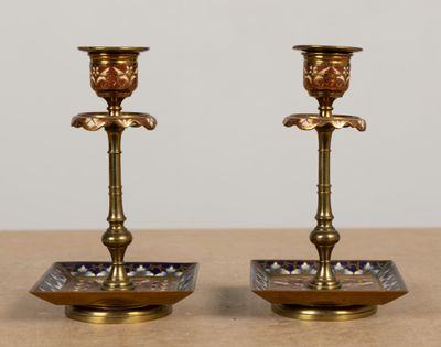 pair of antique brass candlesticks with blue and white glass accents
