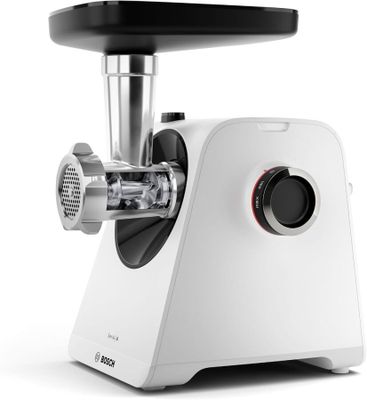 a close up of a meat grinder on a white surface