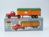 two toy trucks that are sitting on top of a box