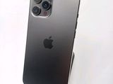 an iphone 11 is shown with a camera attached to the back of it