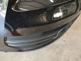 a close up of a car ' s front bumper
