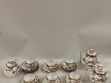 a lot of tea cups and saucers on the table