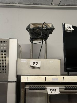 a television on top of a stove in a store