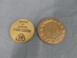 a gold coin with a picture of a man on it