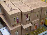several boxes of coffee are stacked on top of each other in a carton