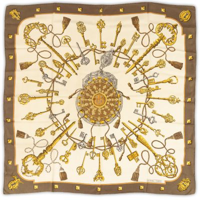 a square scarf with a bunch of keys and keys on it