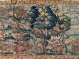 une image représentant une tapisserie ornée d'animaux et d'arbres