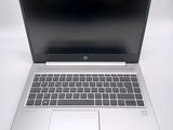 an open laptop computer sitting on top of a white table