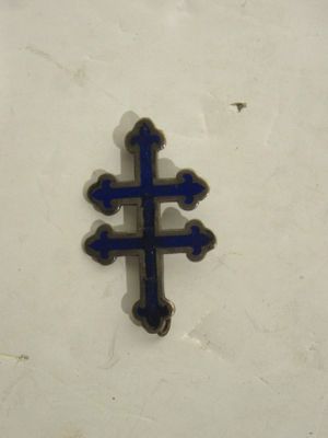 a small blue cross on a white surface