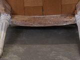 a chair that is made out of wood and has a seat made out of bricks