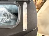 a trash can with a plastic bag inside of it