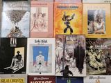 a lot of books that are on the table