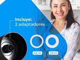 the woman is smiling while holding a camera in her hands