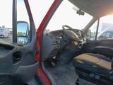 a red truck with the driver ' s door open