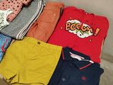 a lot of clothes that are sitting on a box