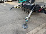 a small machine that is parked in a parking lot