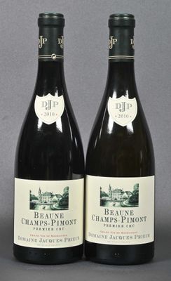 two bottles of wine are sitting next to each other on a table