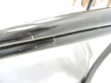 a close up of a metal handle on a chair