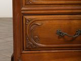 a wooden dresser with two drawers and a mirror on top