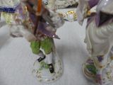 three figurines that are sitting on a table