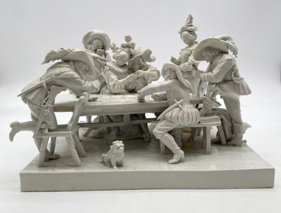 a statue of a group of people sitting at a table
