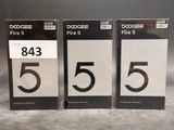 three black and white numbered numbers are displayed on a table