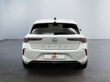 the rear end of a white car in a white room
