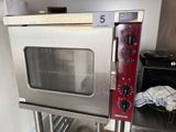 an image of a commercial oven in a commercial kitchen