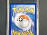 a close up of a pokemon card in a plastic case