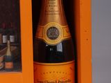 a bottle of champagne in a small orange box