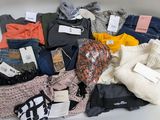 a pile of clothing that is sitting on a table