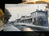 a black and white photo of an old train station