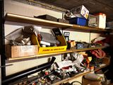 a shelf full of assorted items in a garage